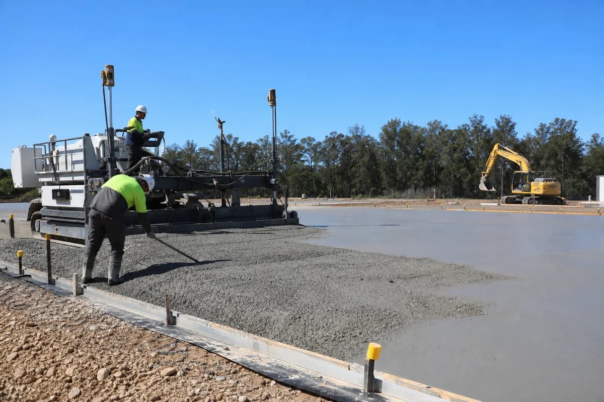 Battery storage civil works hardstand being finished on a NSW BESS pad under midday light