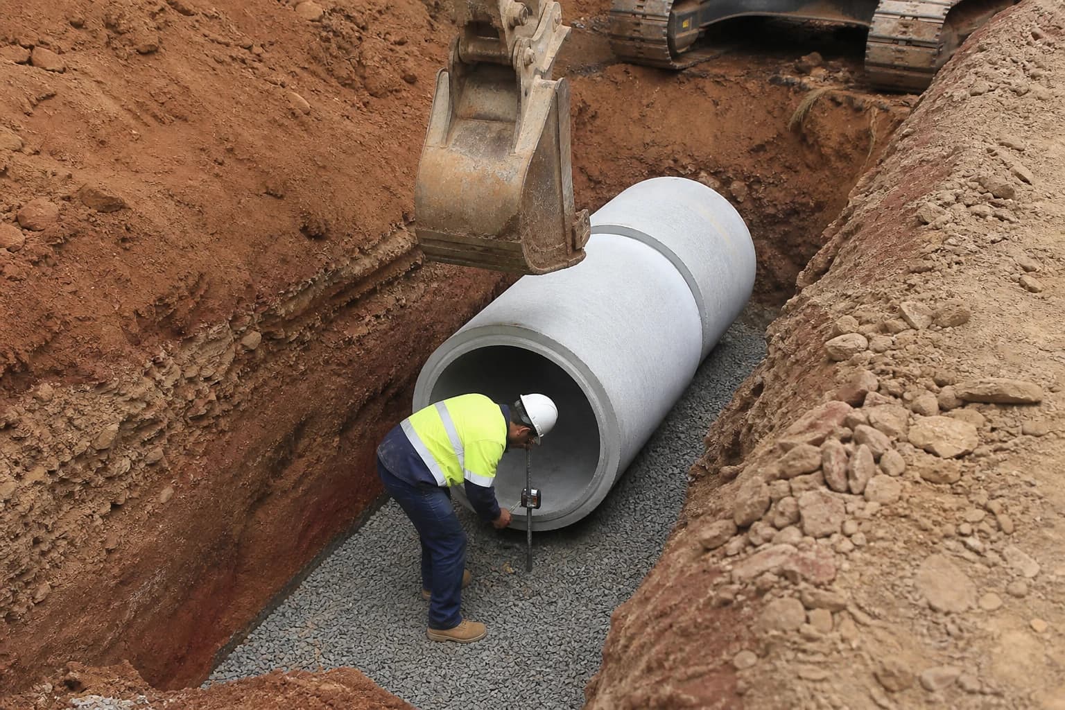 Drainage contractor Greater Sydney stormwater pipe bedding in trench on NSW civil site