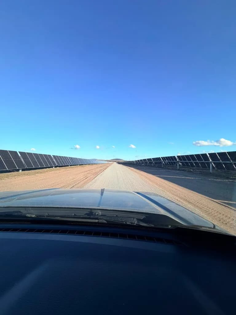 Array access road between solar panel rows at Blind Creek Solar Farm.